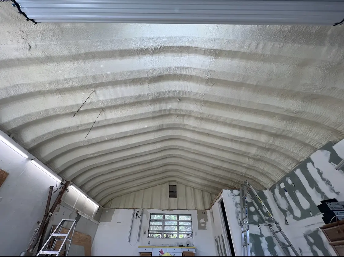 Spray polyurethane foam applied to the underside of a metal roof deck in Black Diamond